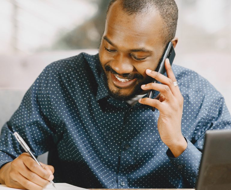 Guy on phone smiling