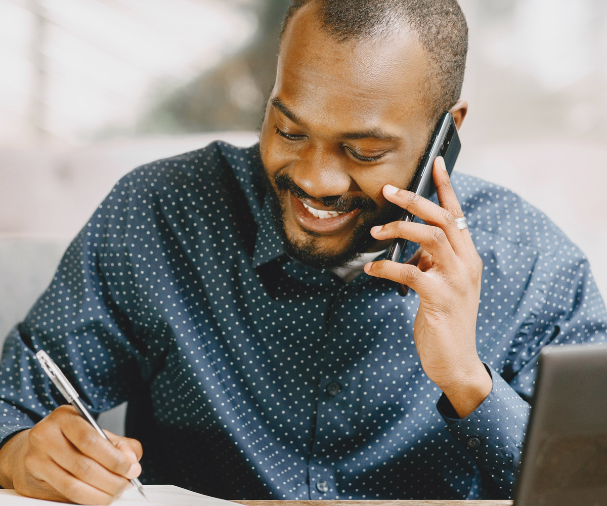 Guy on phone smiling