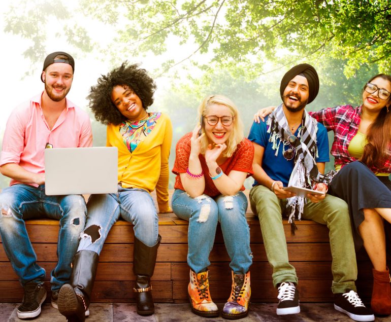 teenagers sitting outside together