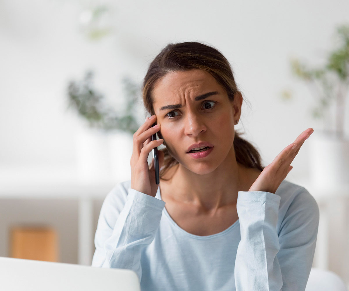 woman on phone frustrated